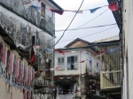 flags spanning the street in stone town